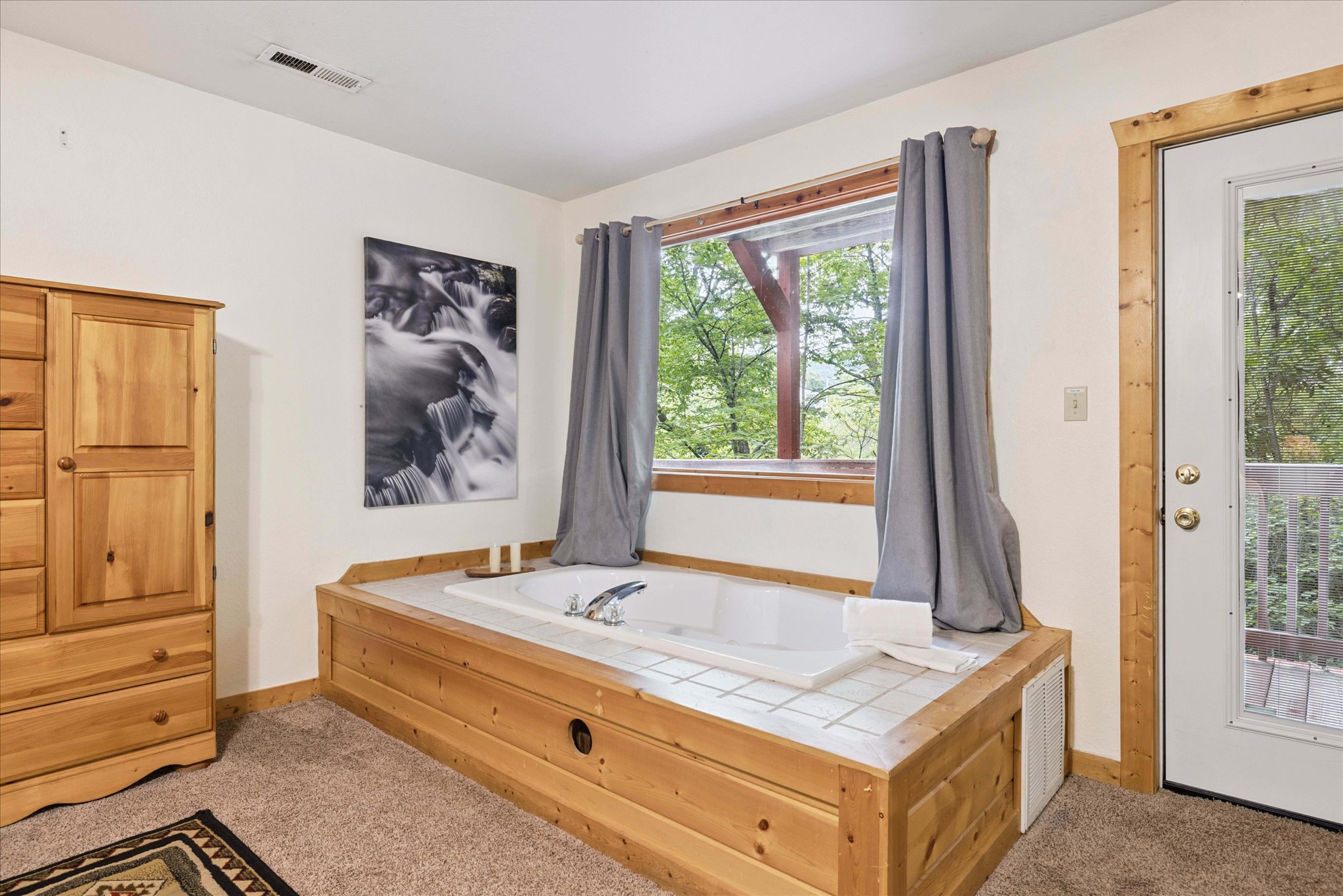 Jetted Jacuzzi tub in master bedroom