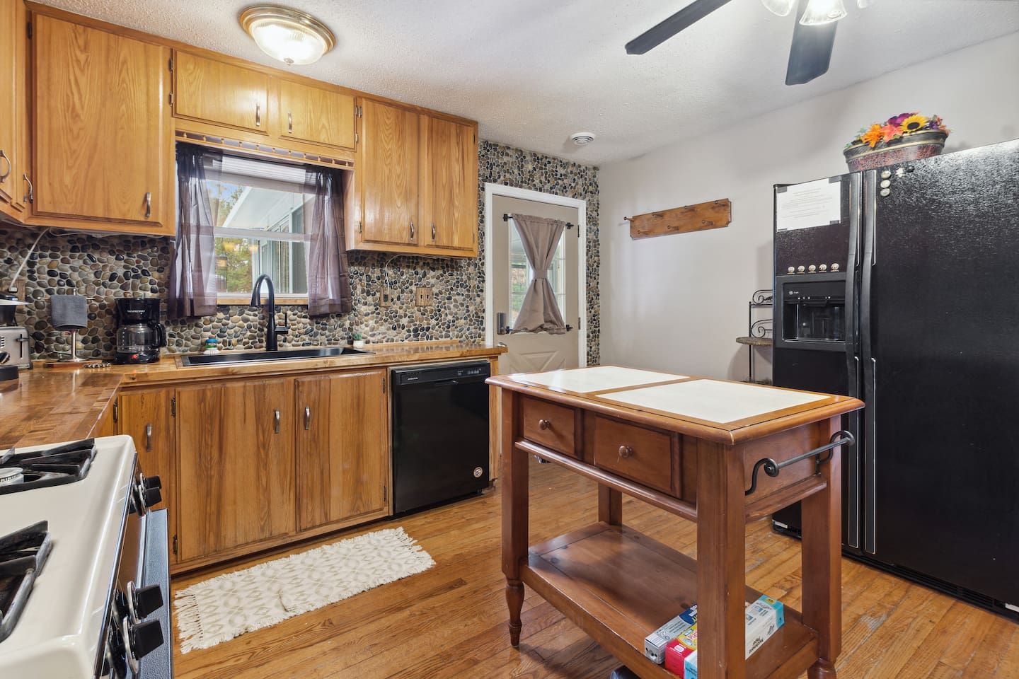 Plenty of space to prepare, silverware and utensils located in kitchen island.