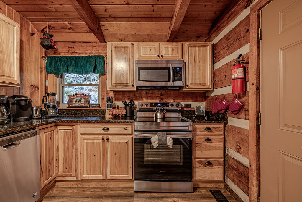 Warm wood cabinetry and all the essentials for home-cooked meals