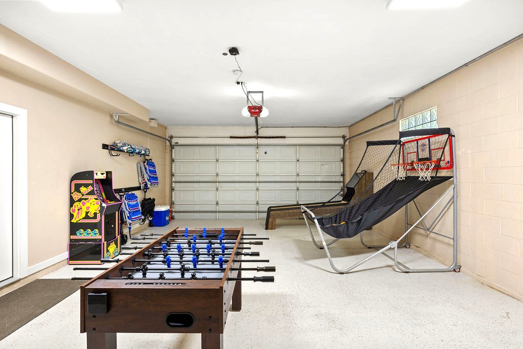 This home has it all — an exciting arcade corner, foosball and skeeball tables, a basketball game setup, and beach essentials ready for your next coastal adventure. Perfect for families and groups who love to play and explore!