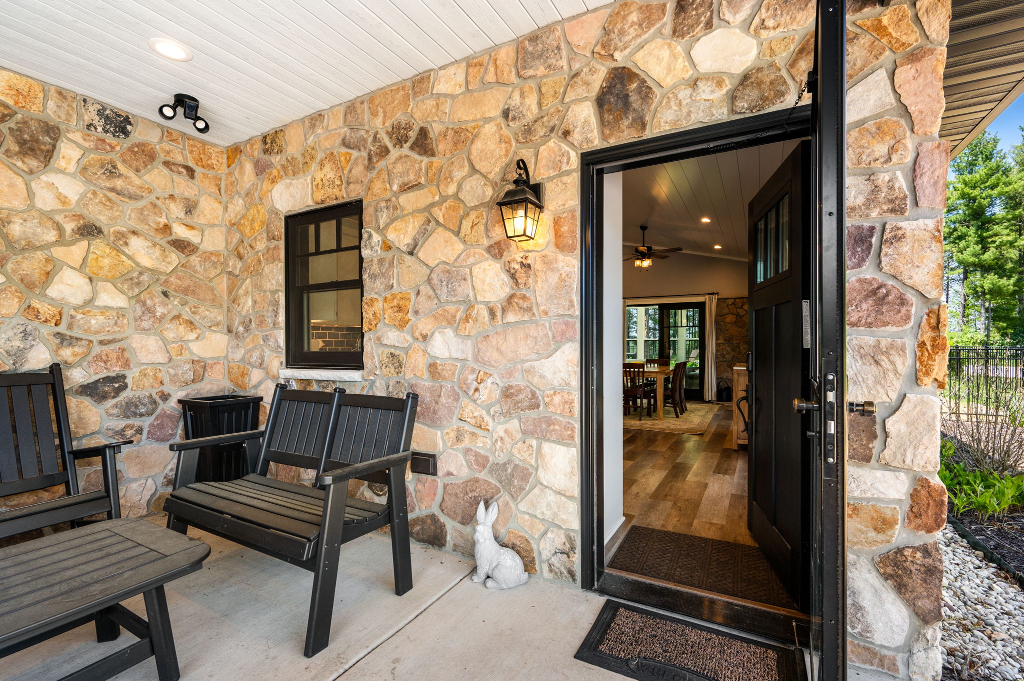 Step through the front door from a charming covered porch and into the warm, kitchen and living space waiting inside.