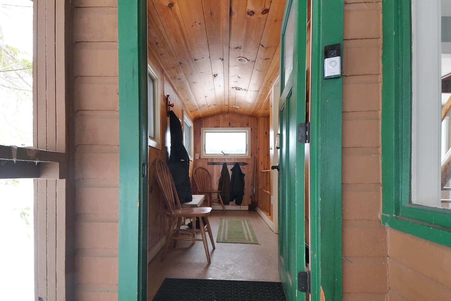Step inside this cozy cabin hallway, where rustic charm meets warm wood tones and lakeside comfort.