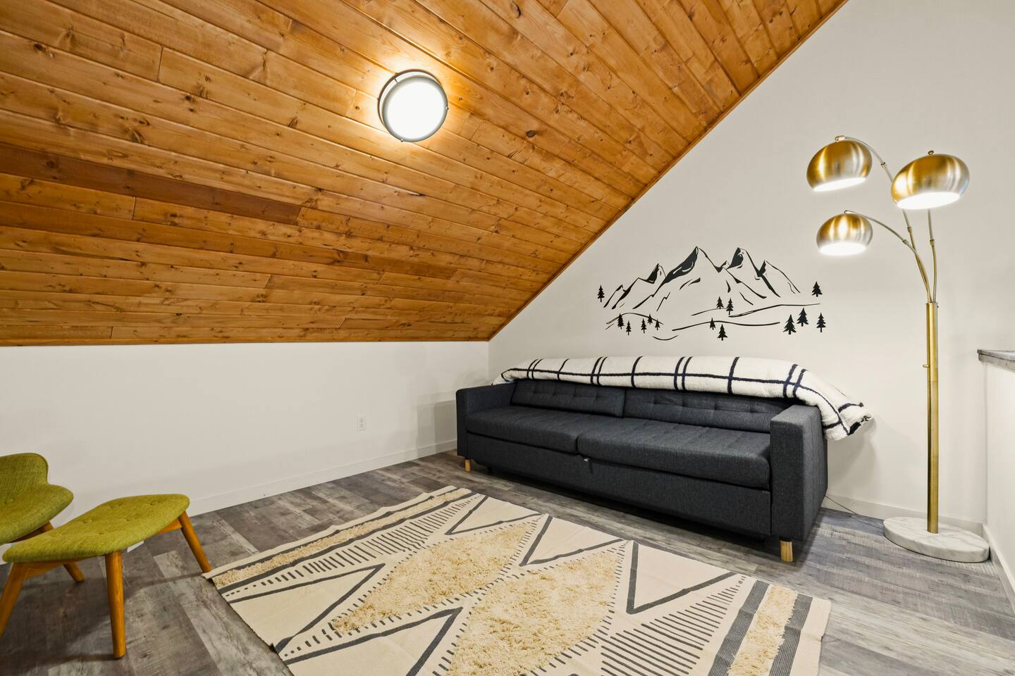 A large and airy loft overlooking the living room for a relaxing down time. The sofa can be converted into a queen sized bed
