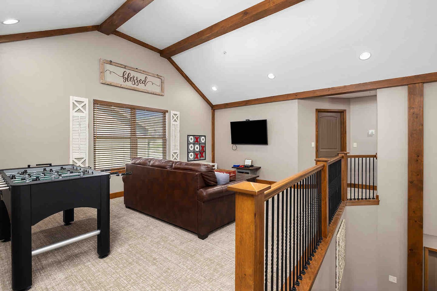 Upper Level Loft with big screen tv, sleeper sofa, and fooseball