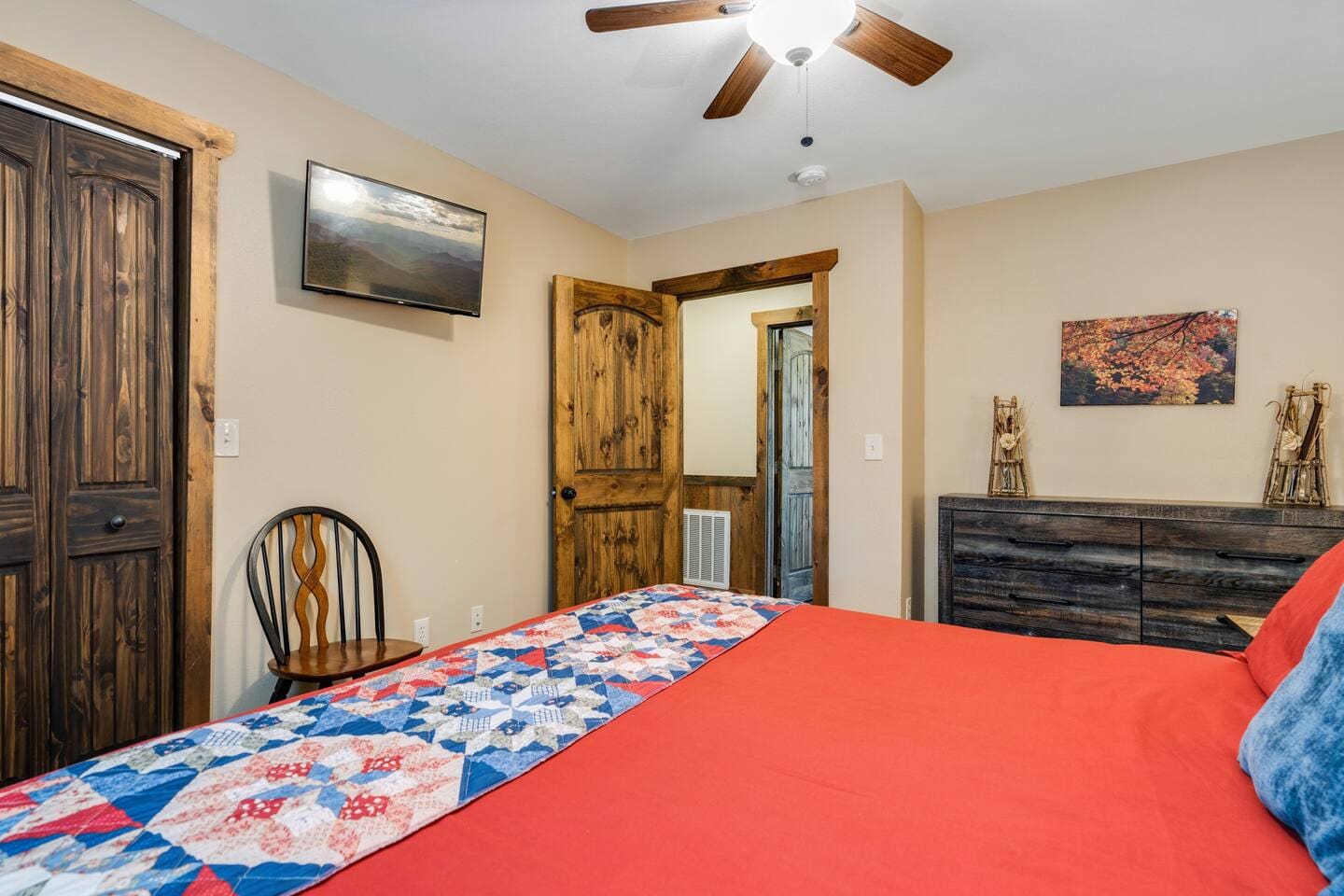 King-size bed, TV and dresser in back bedroom