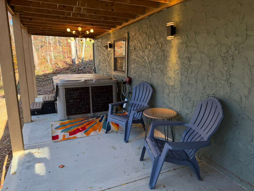 Spa time with a view. The hot tub is complemented by extra lounge seating and ambient lighting for a perfect evening.