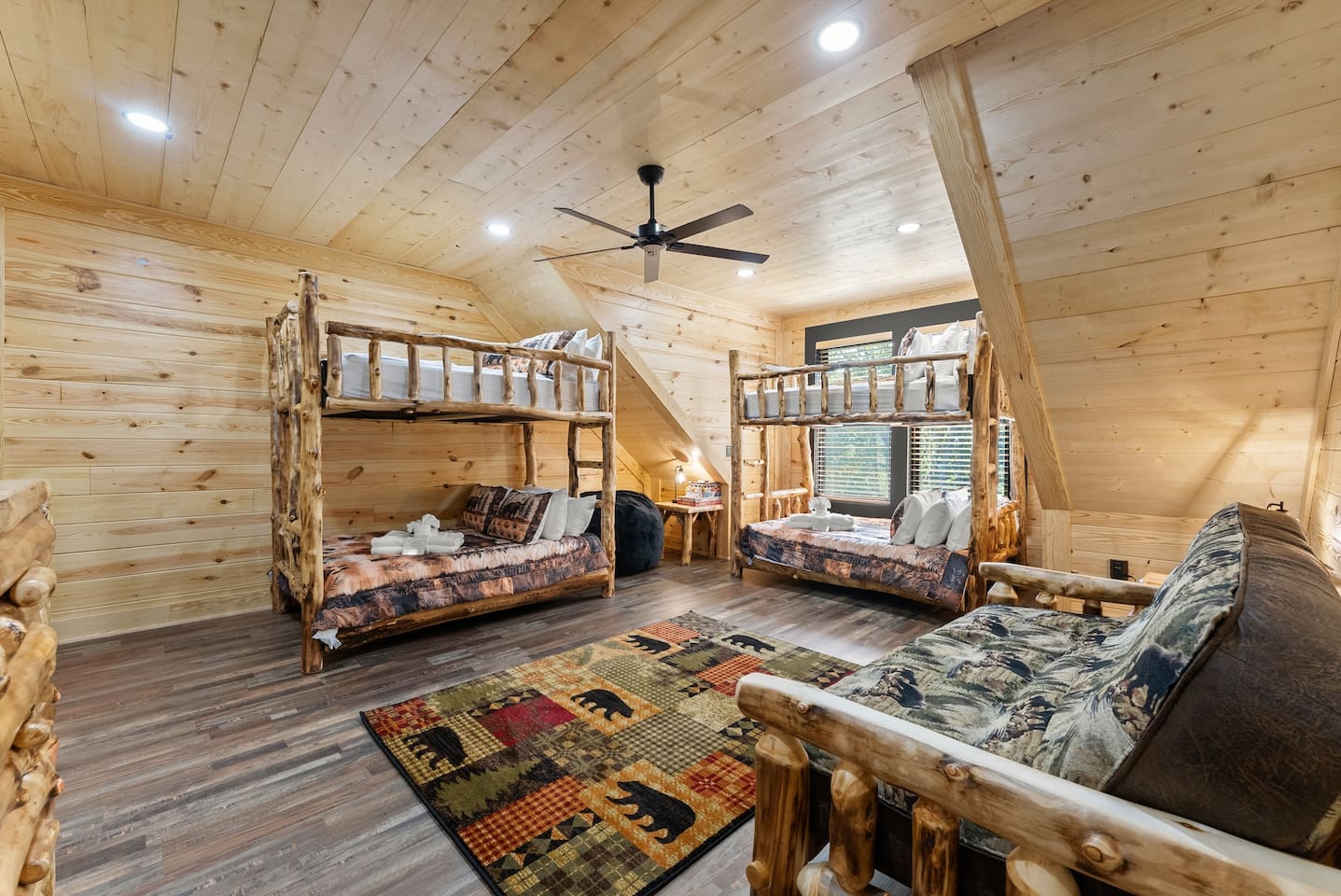 Featuring two full-over-full bunk beds and a log-frame futon, this spacious bedroom is perfect for kids, cousins, or friends traveling together.
