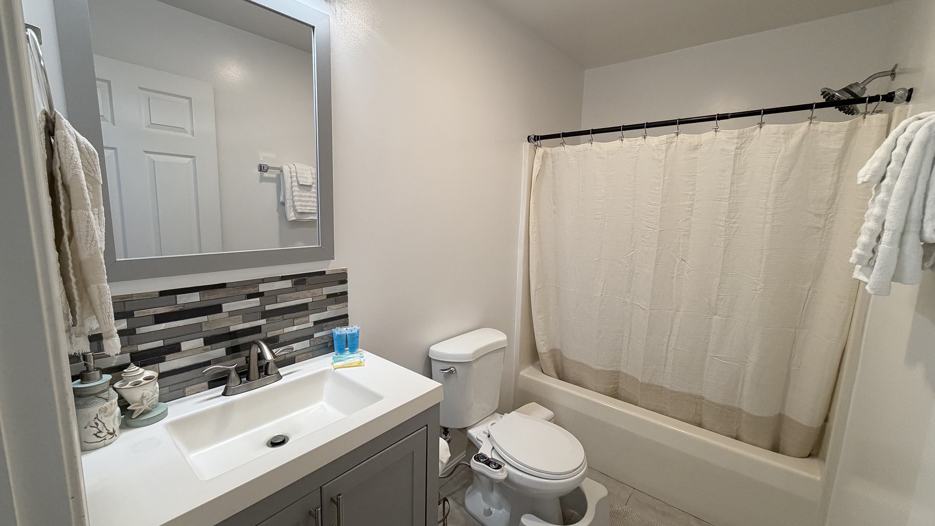 Full bathroom with tub and shower