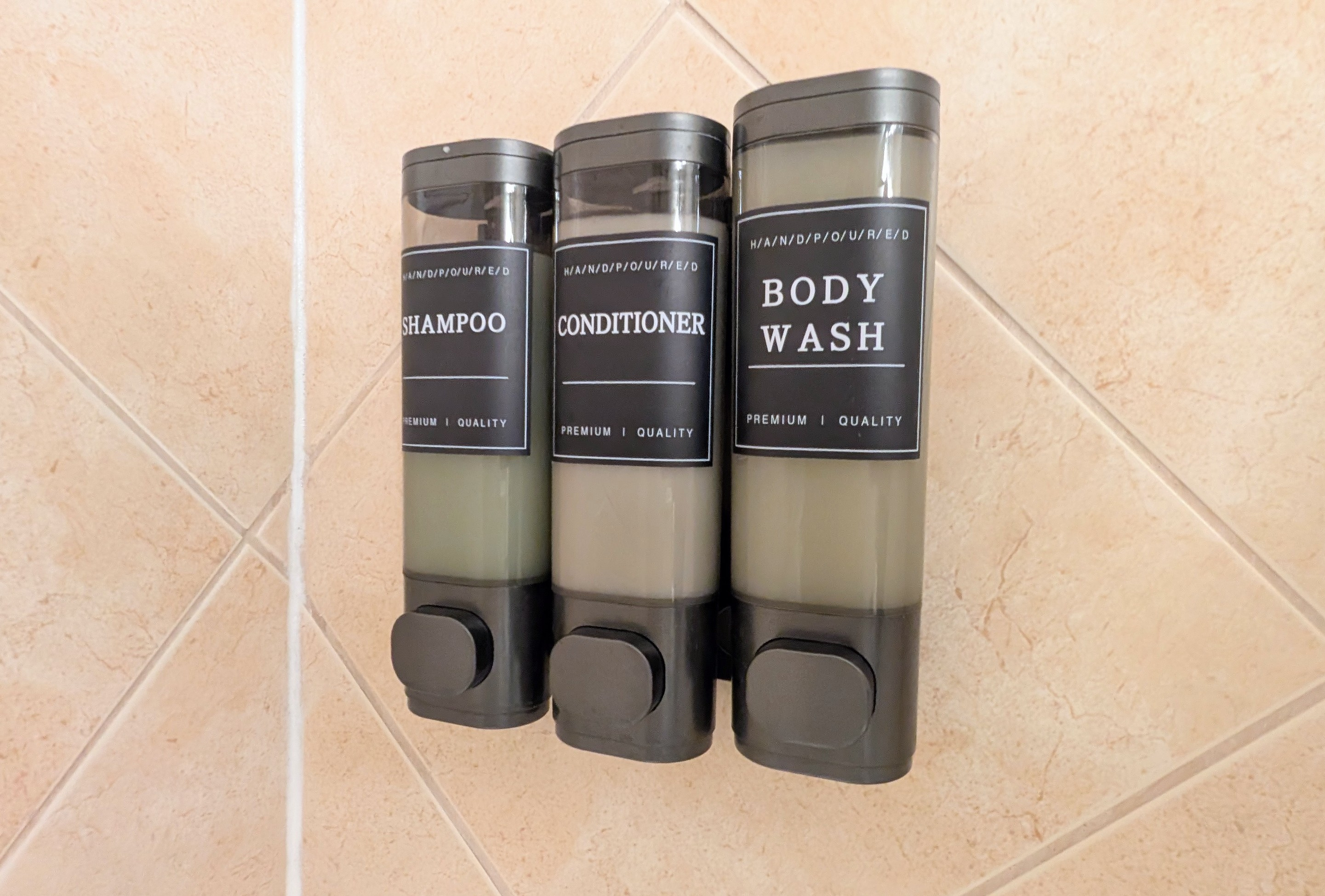 Shampoo, conditioner, and body wash are within easy reach in each shower.