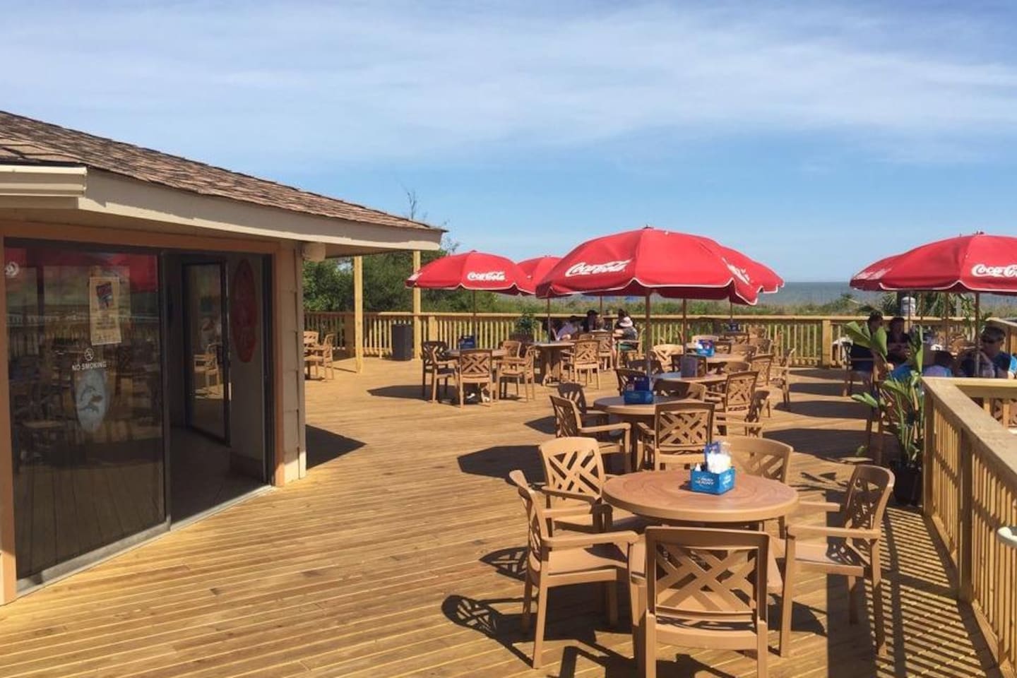 Outdoor dining deck with ocean view