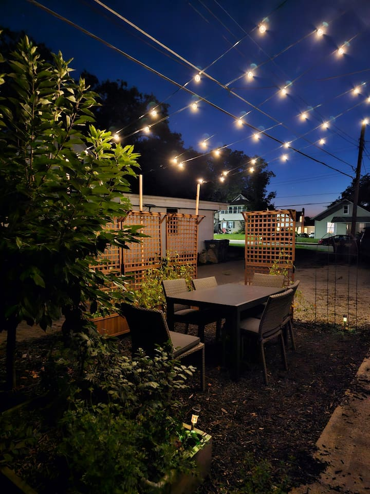 Enjoy dining under the lights in the garden.