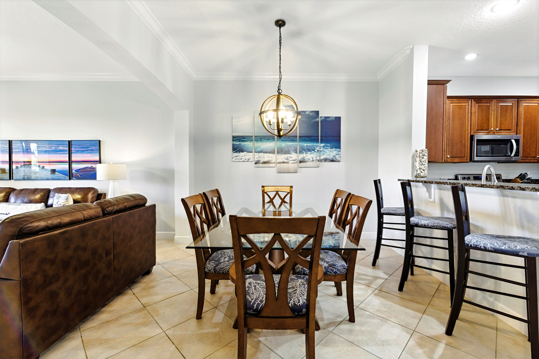 Bright, open gathering space for meals, games, and beach-day recaps. 🍽️🌴
Enjoy a full dining table plus bar seating—perfect for family dinners, morning coffee, or planning your next Cinnamon Beach adventure just steps from the ocean.
