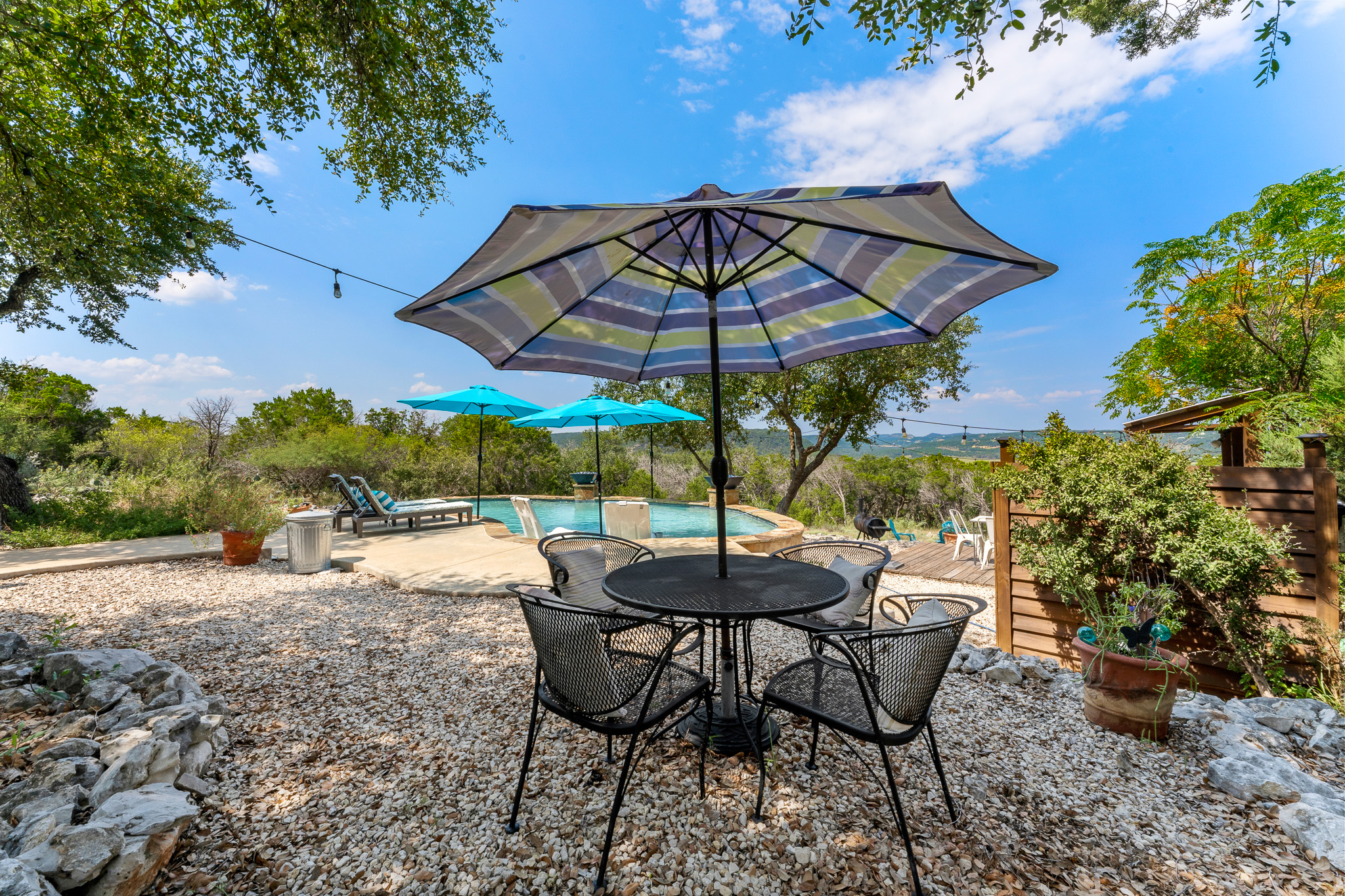 A shady patio for afternoon stillness or evening chats with a breeze.