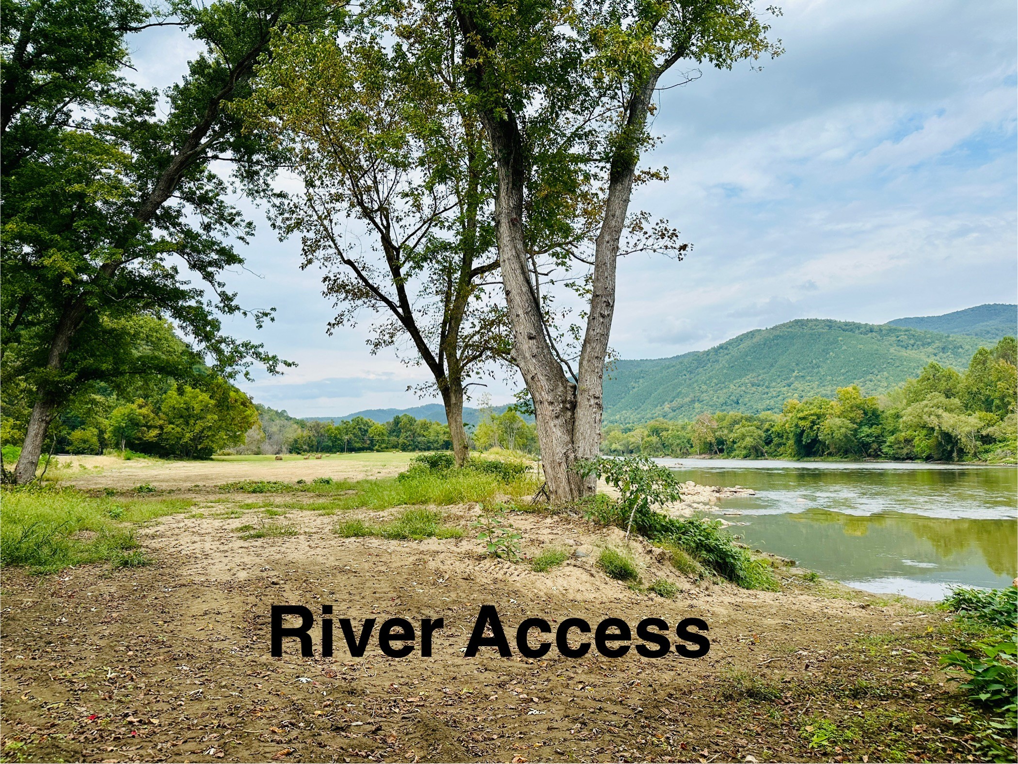 To access the river, walk over the railroad crossing into a large field. The walk down to the river is on the far right of the field. 