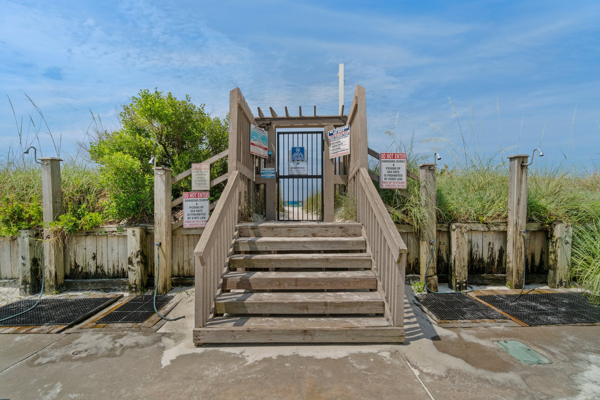 private beach entrance with showers