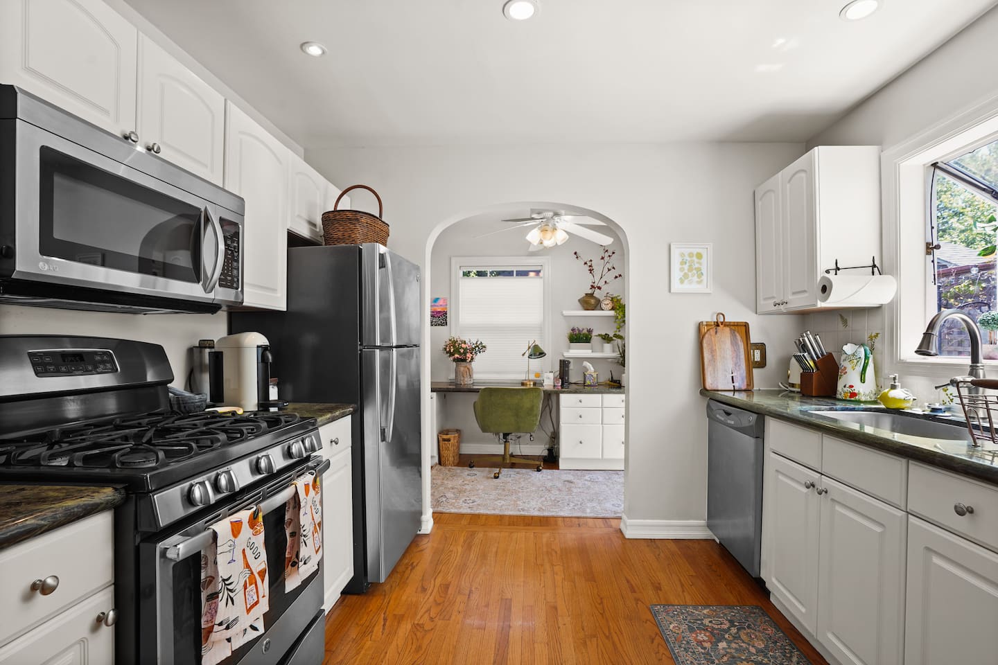 Wine glasses, mugs and cooking utensils are provided.
