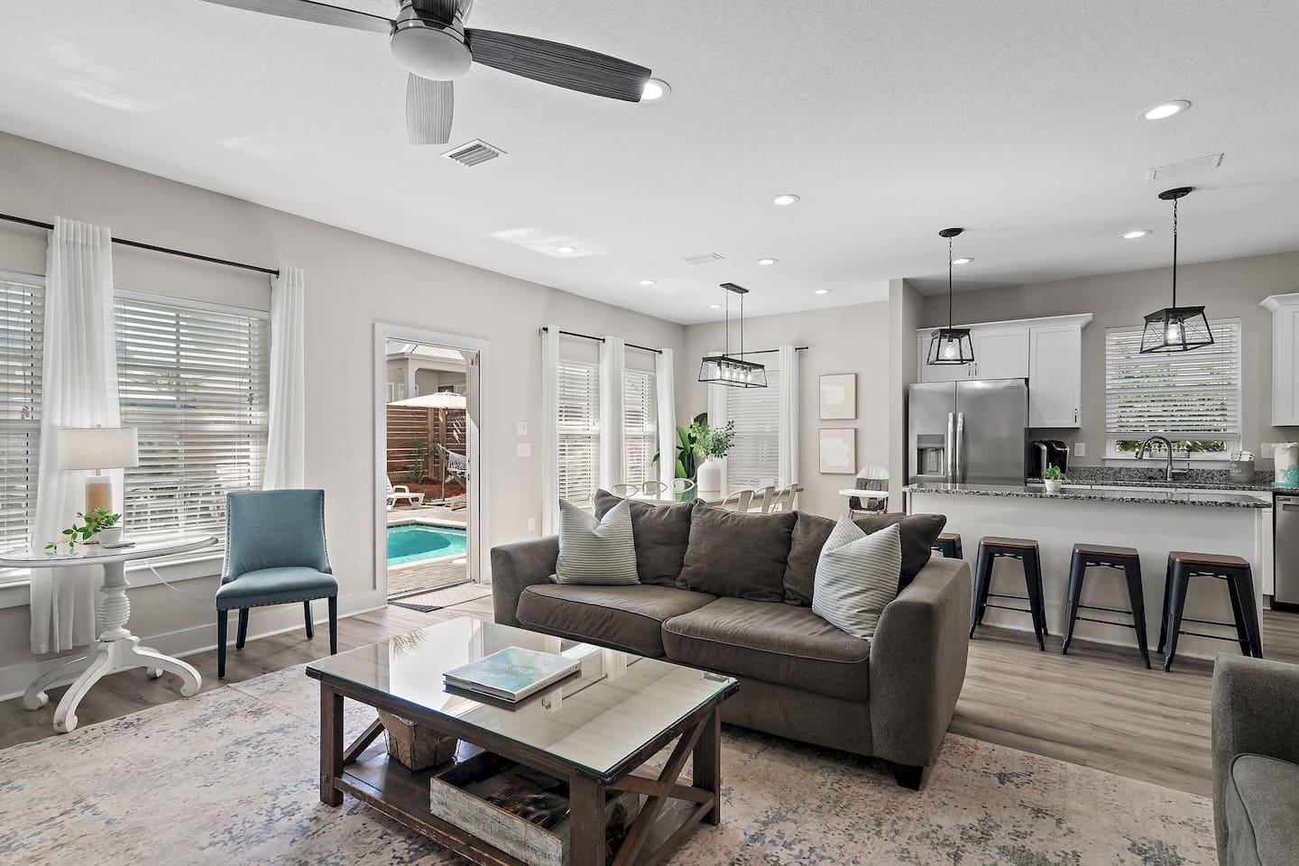 Living room opens directly to the pool area.