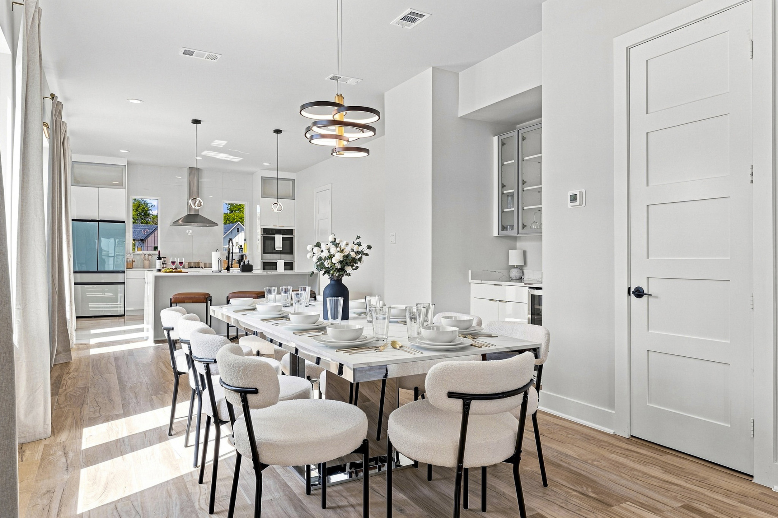 Bright space with sleek furniture, perfect for meals and laughter!