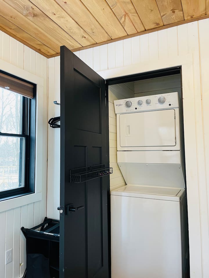 The laundry facilities are in a closet located in bedroom number one.