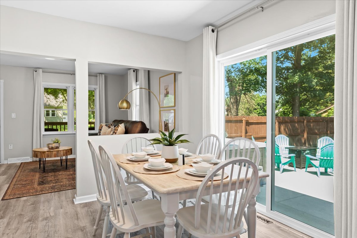 Dining area with seating for six, overlooking the backyard