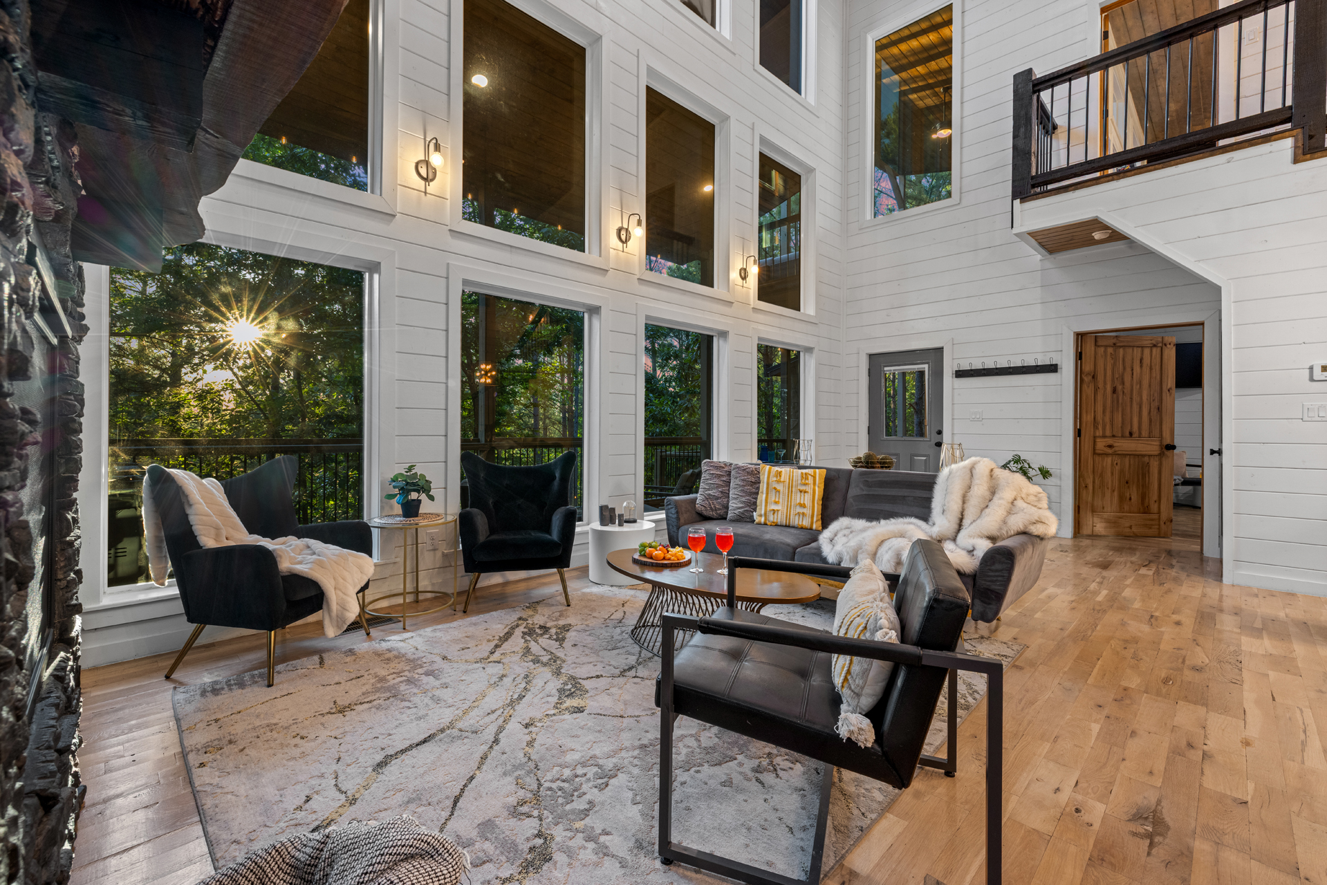 Stylish living area with inviting couches, warm fire feature, and TV for laid-back nights.