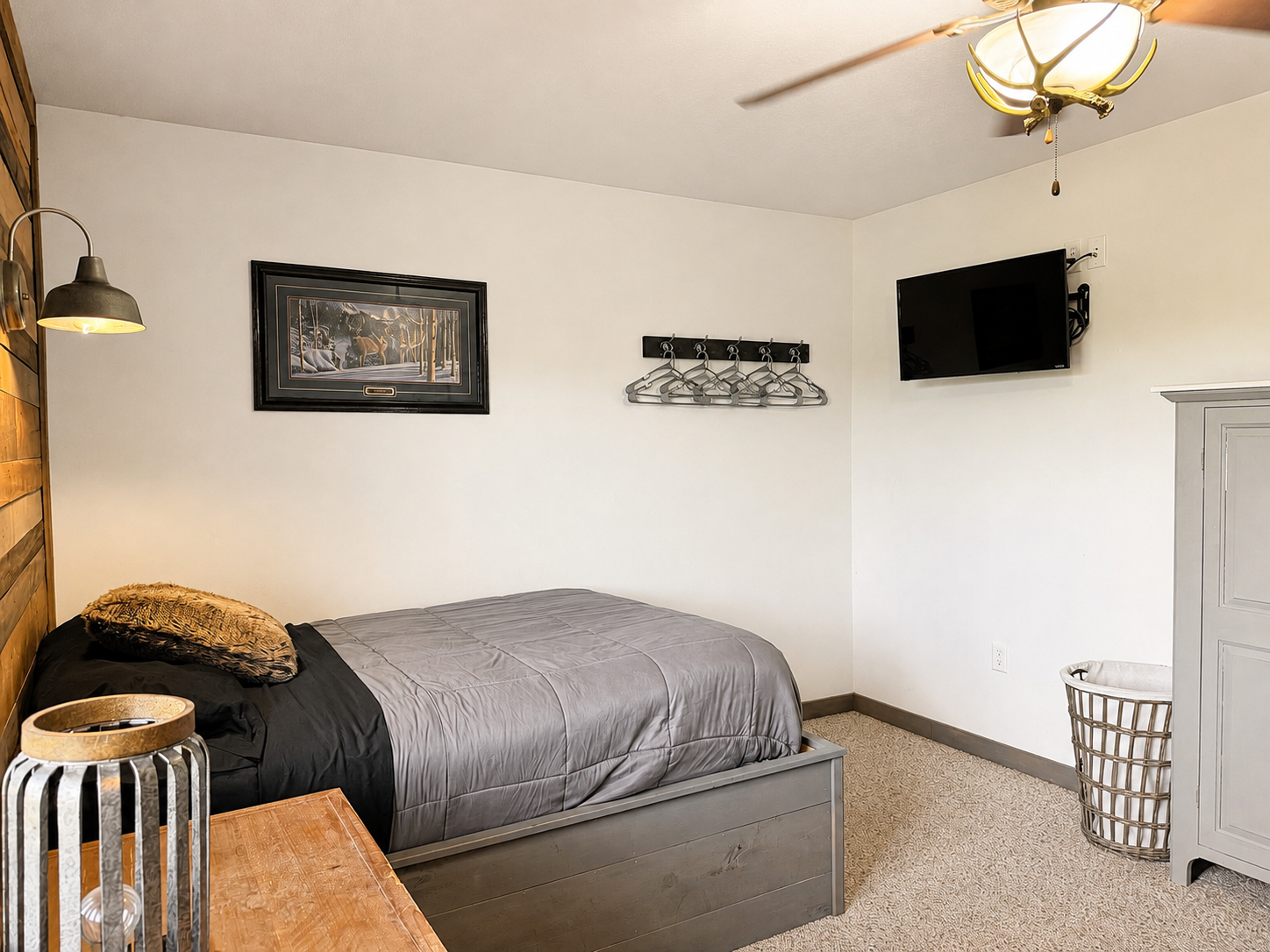 This bedroom comes with its own wall-mounted TV as well, giving guests a private place to kick back, relax, and enjoy a little downtime at the end of the day.
