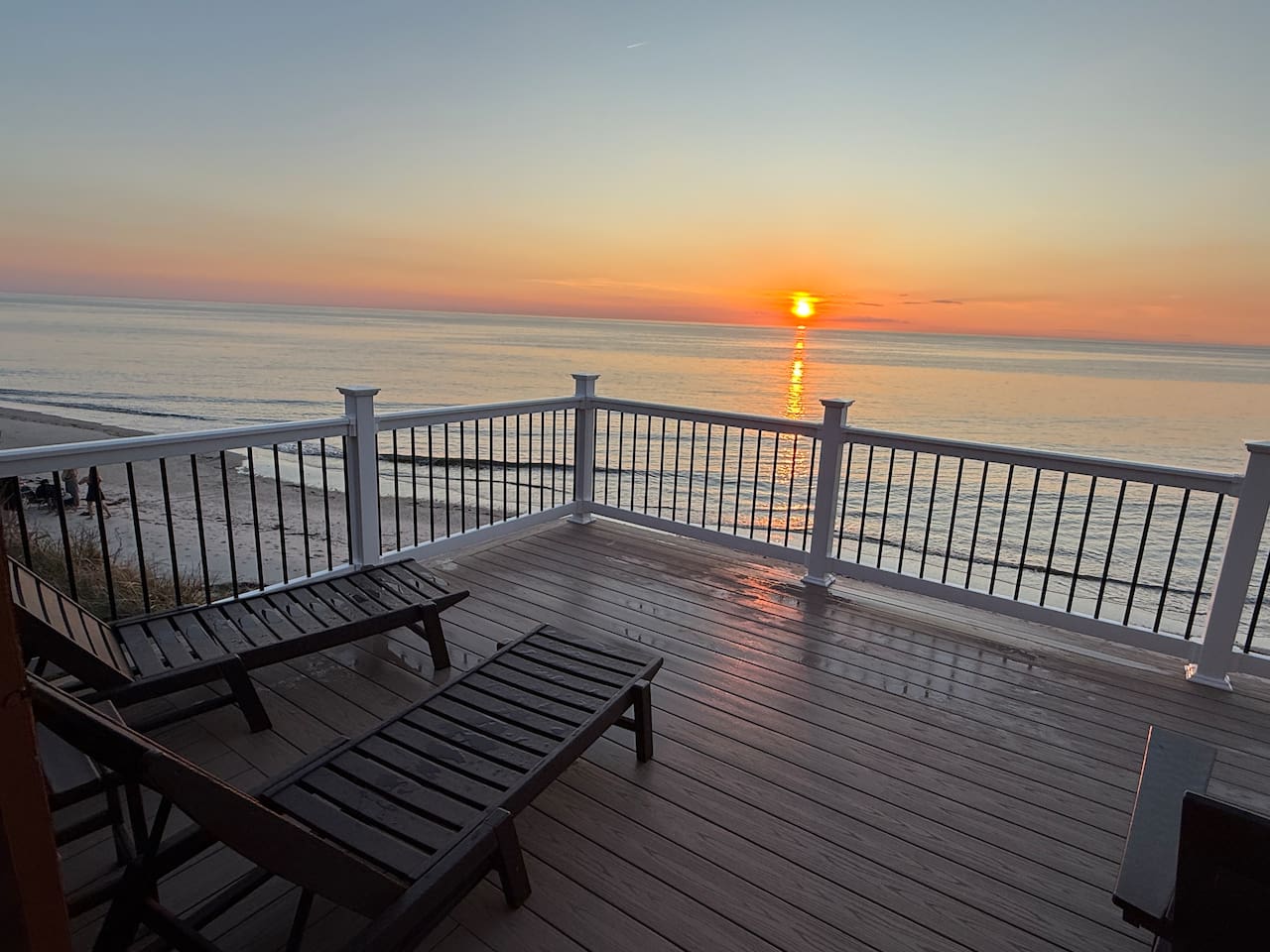 Unwind on the expansive private deck, the ultimate spot for sunset views. Lounge in comfort as the golden sun dips below the horizon over the calm ocean, providing a perfectly serene atmosphere for your luxury getaway.