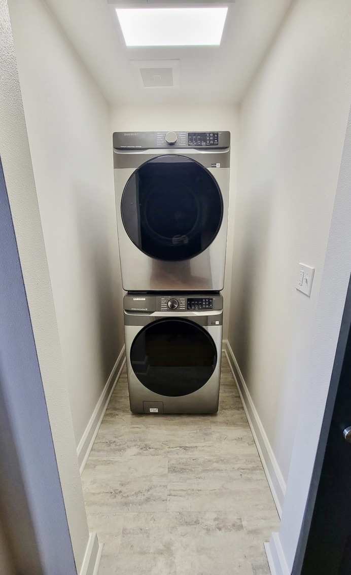 In-unit stackable washer dryer combo provided.