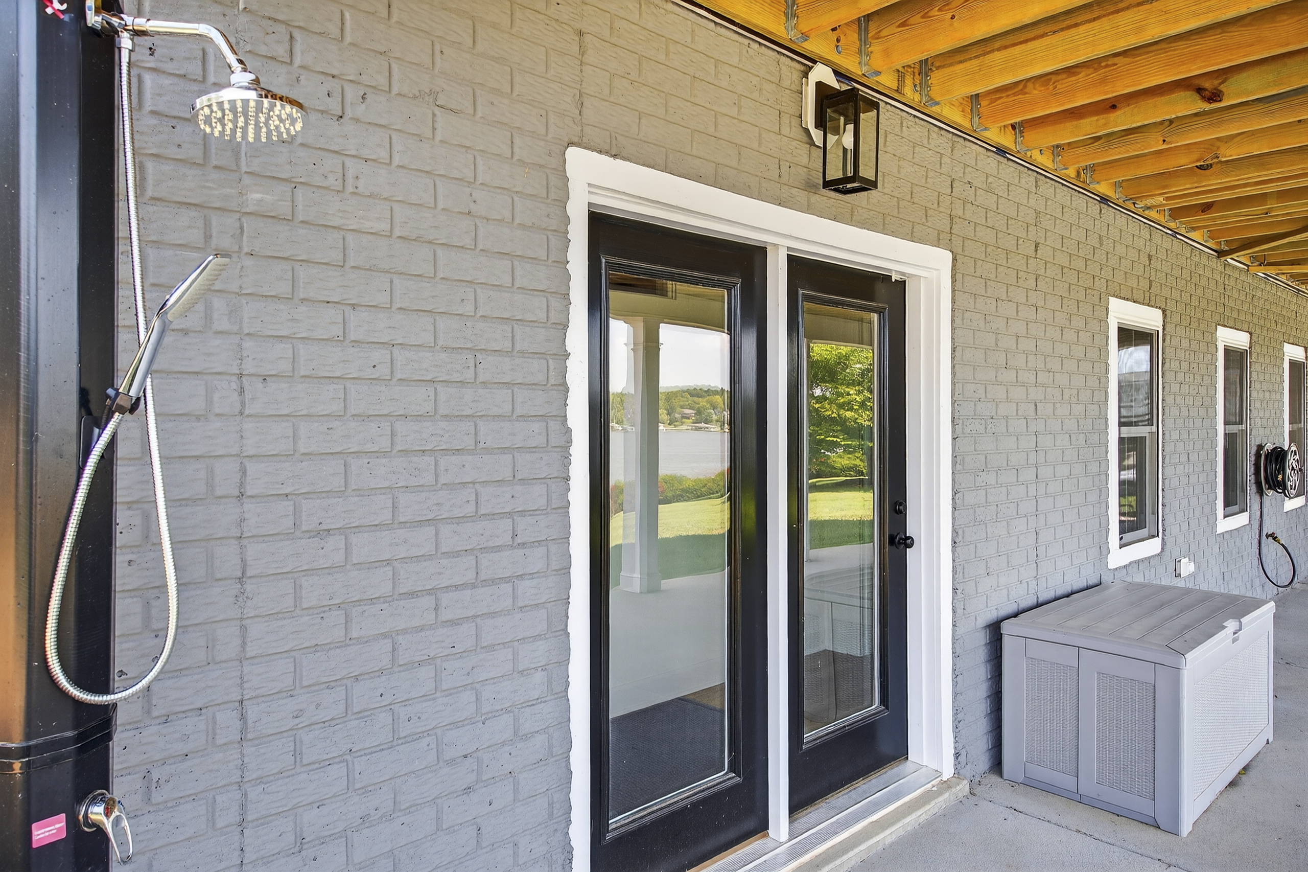 Rinse off sandy toes and sun‑kissed skin in the private outdoor shower before heading inside.