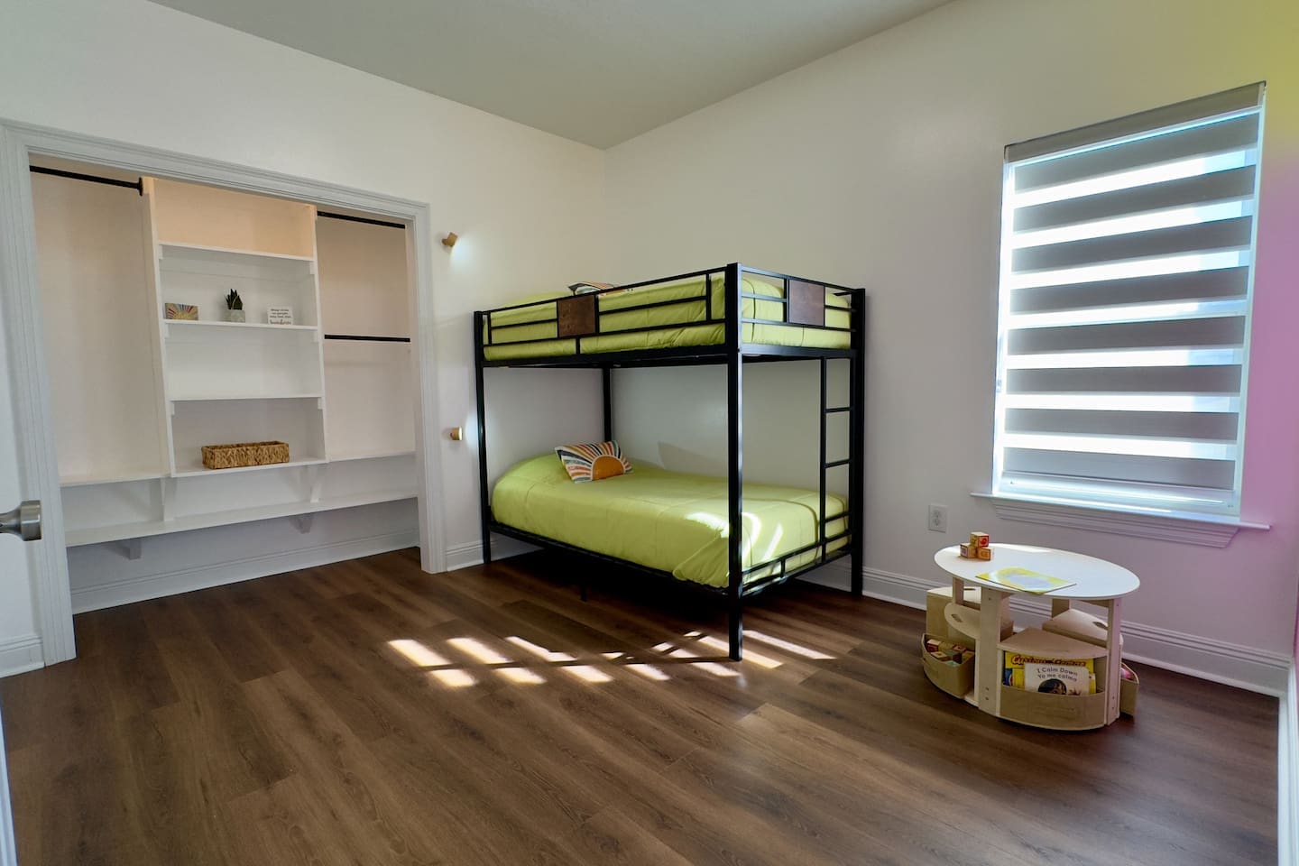 Built-in closet shelves with baskets and decorative items maximize space while maintaining a minimalist look.