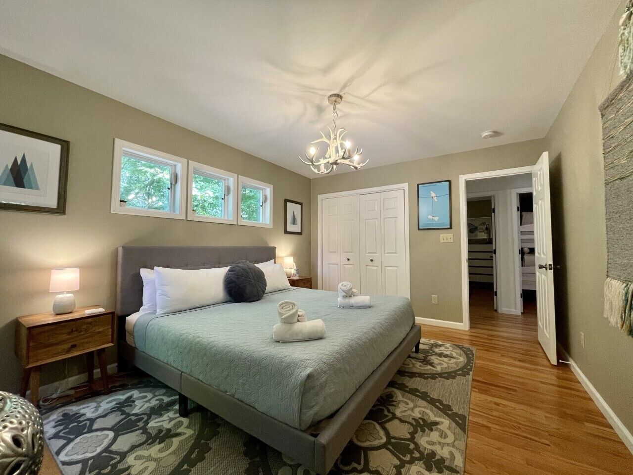 Master Bedroom at the end of hall. You can see the doors to other bedrooms