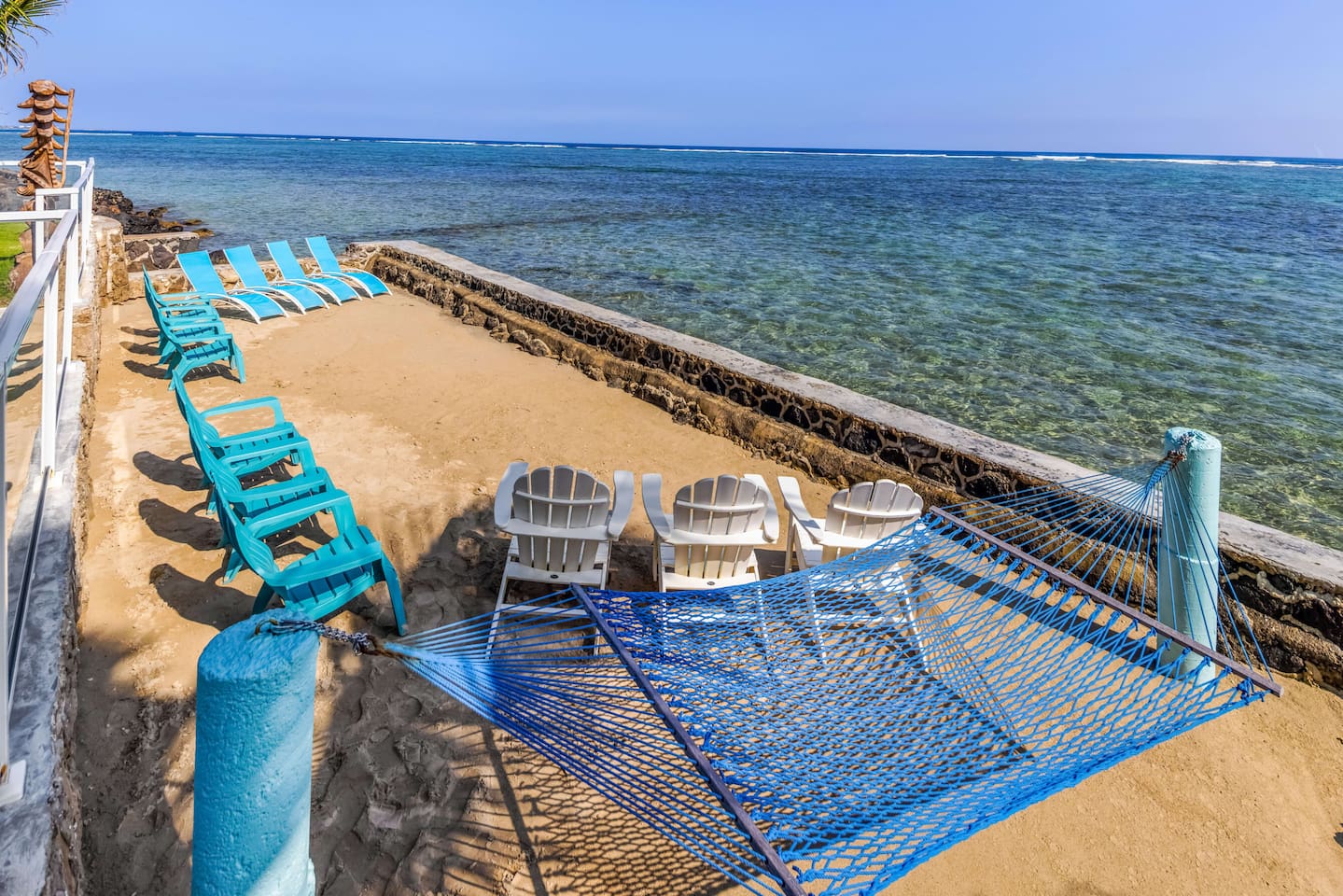 Crystal clear snokerking reef at high tide in enclosed sea-walled private beach