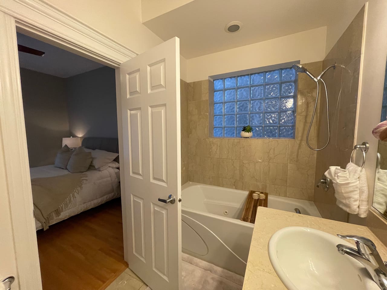 Clean in-suite bathroom with a jet tub