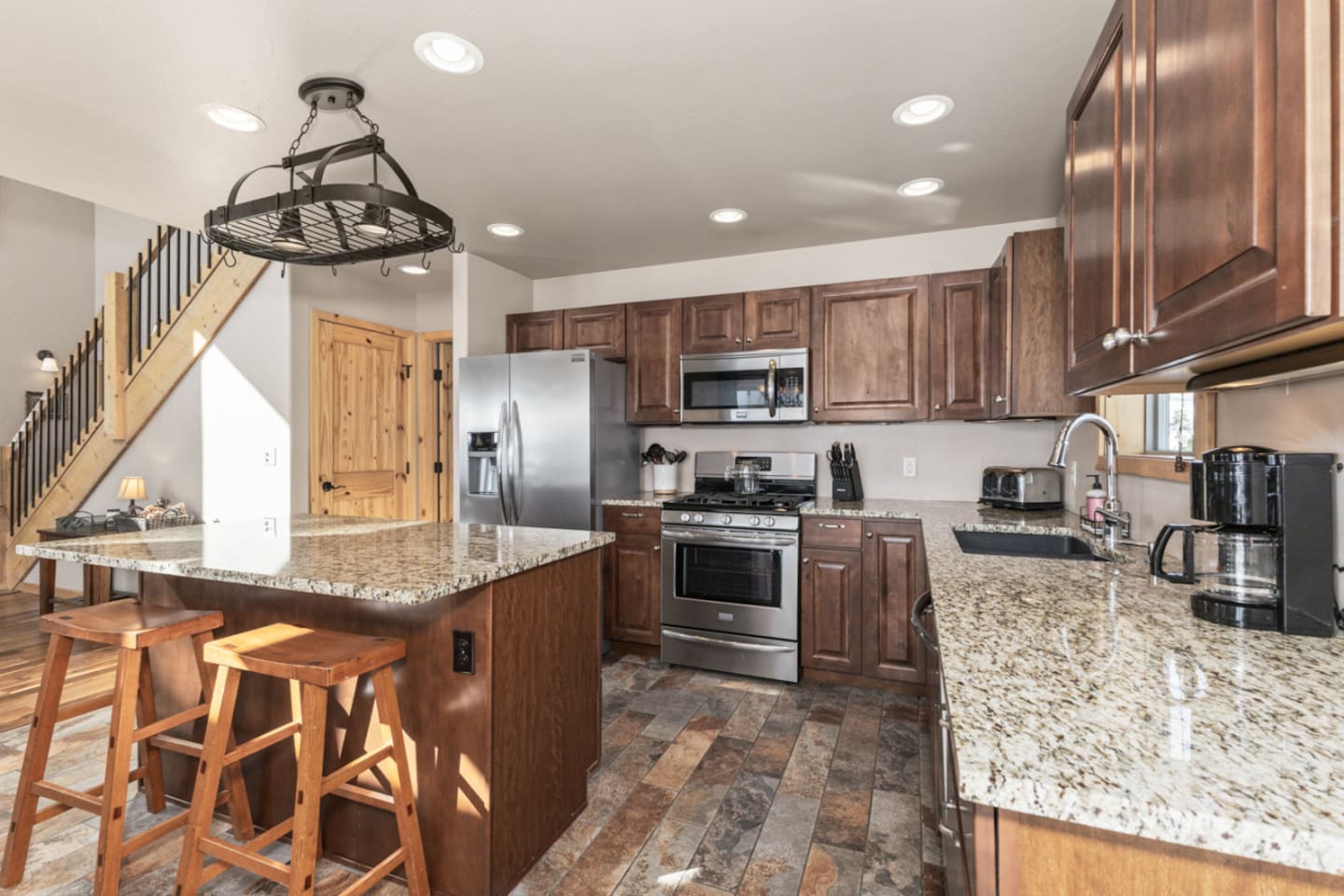 Kitchen – 4 burner gas stove | Breakfast bar for 2 