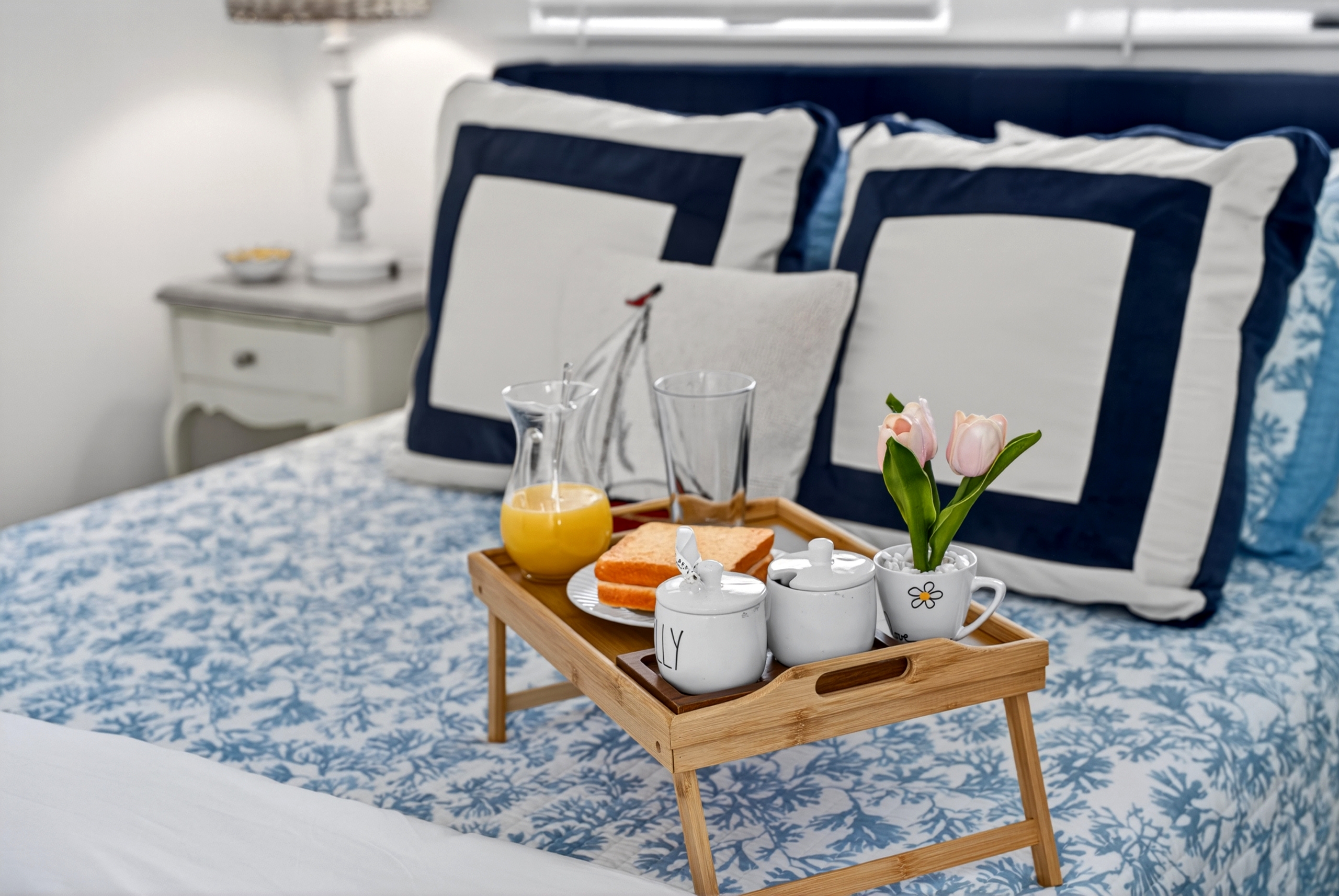 Bright queen bedroom with easy bathroom access and direct entry to the second-floor deck.