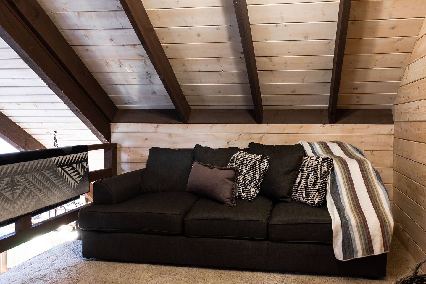 Upstairs loft has a pull out couch and a little reading nook.
