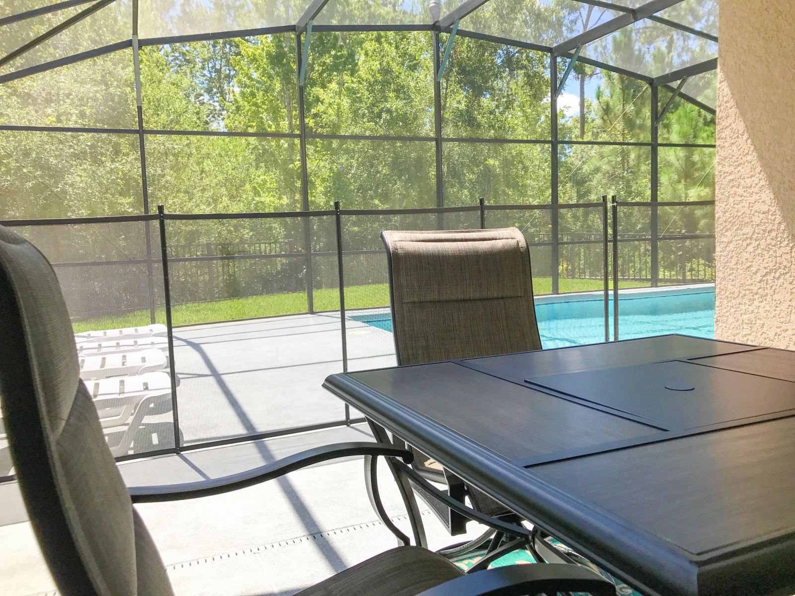 Outdoor dining area under covered lanai