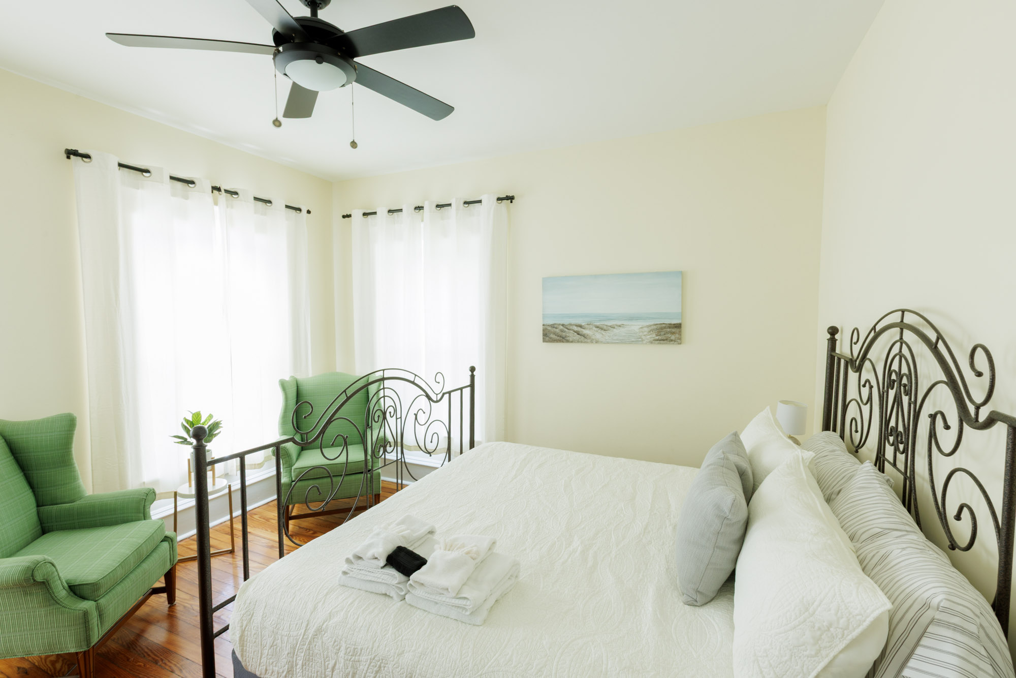 Large King Bedroom with some seating for when getting ready to go to the beach.