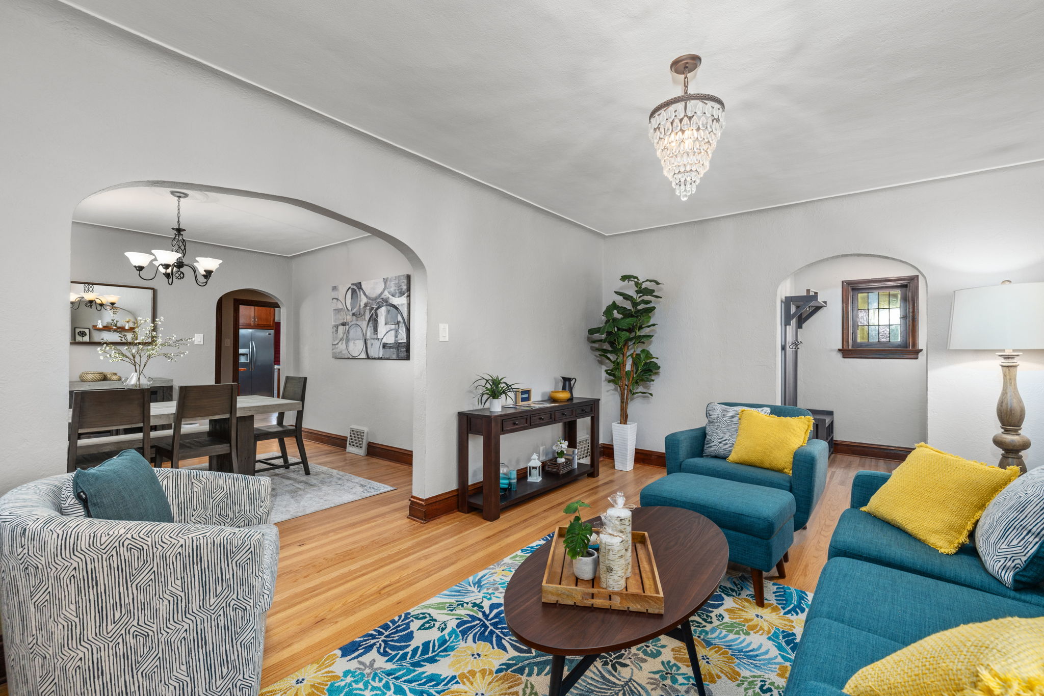 Main level living area with ample seating for 6+ and artificial fireplace.