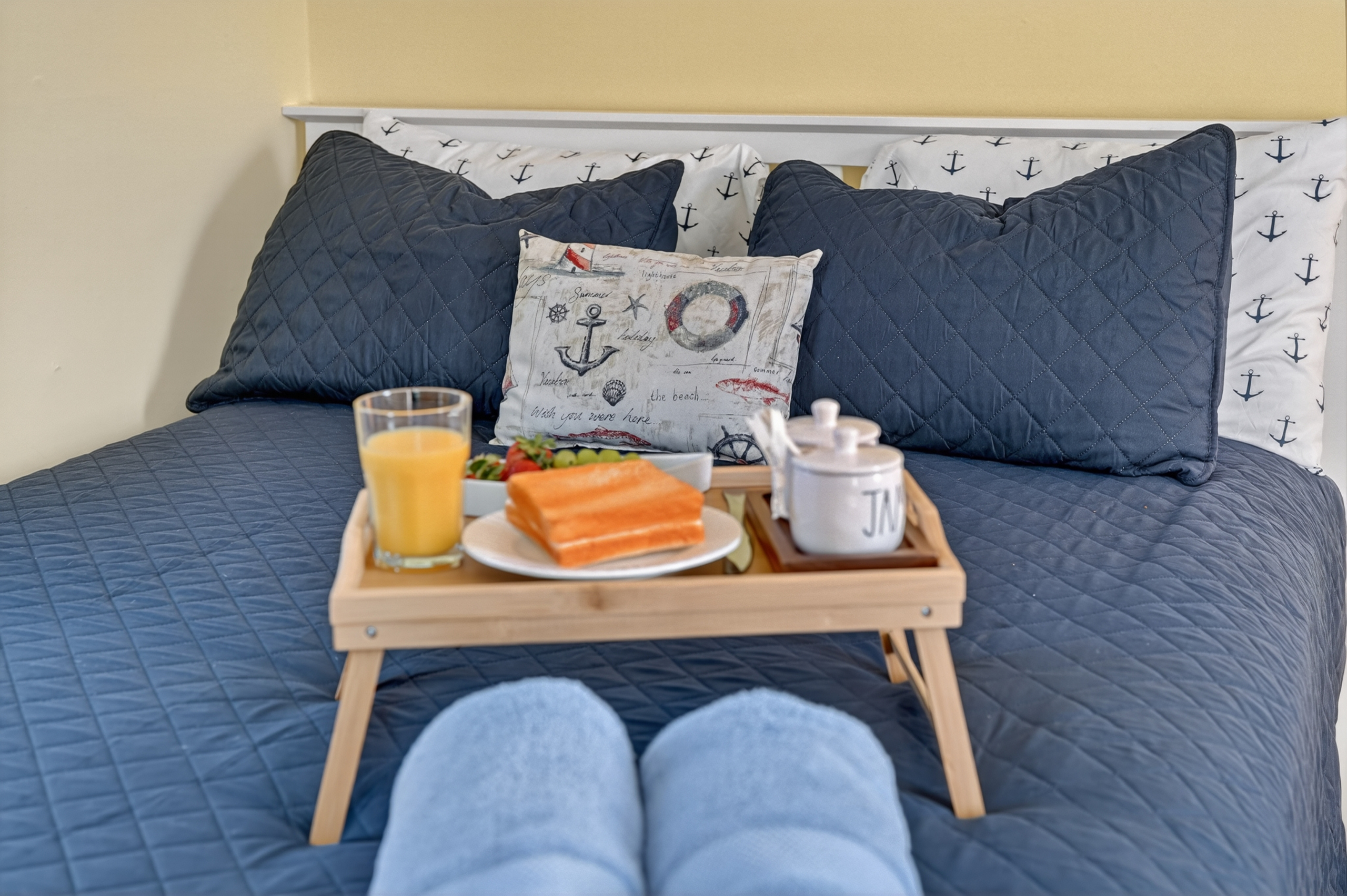 Enjoy breakfast in bed or a quiet evening with the thoughtfully styled guest bedroom retreat.