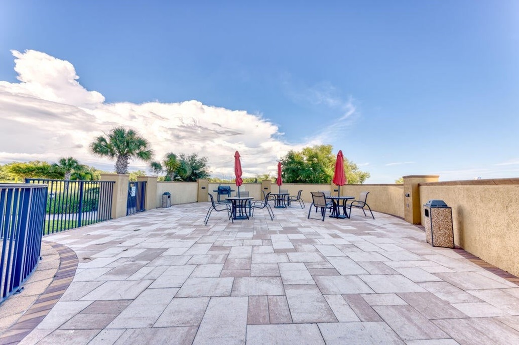 Outdoor pool deck and grill.