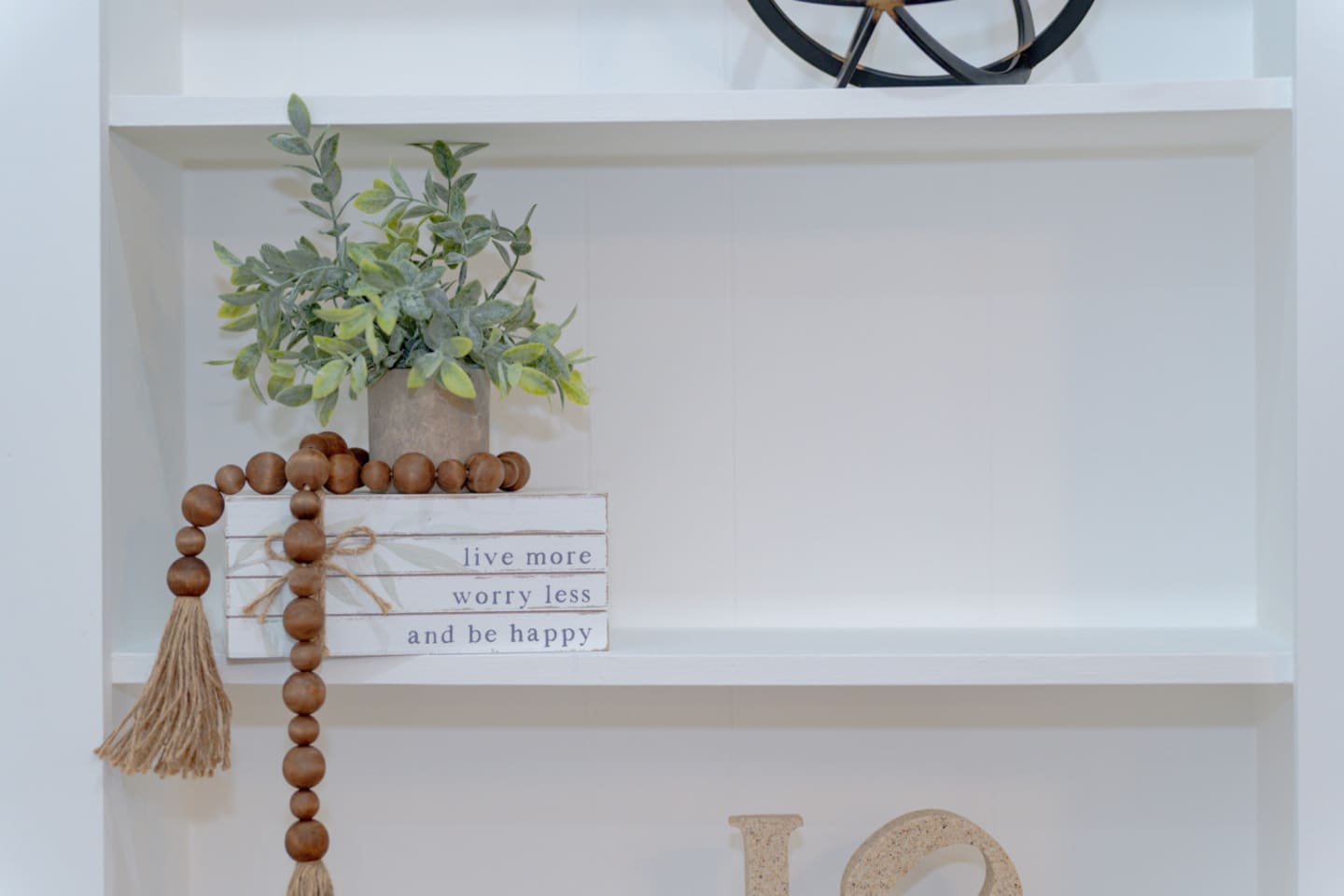 Decorative shelving adding depth and warmth to the living room.