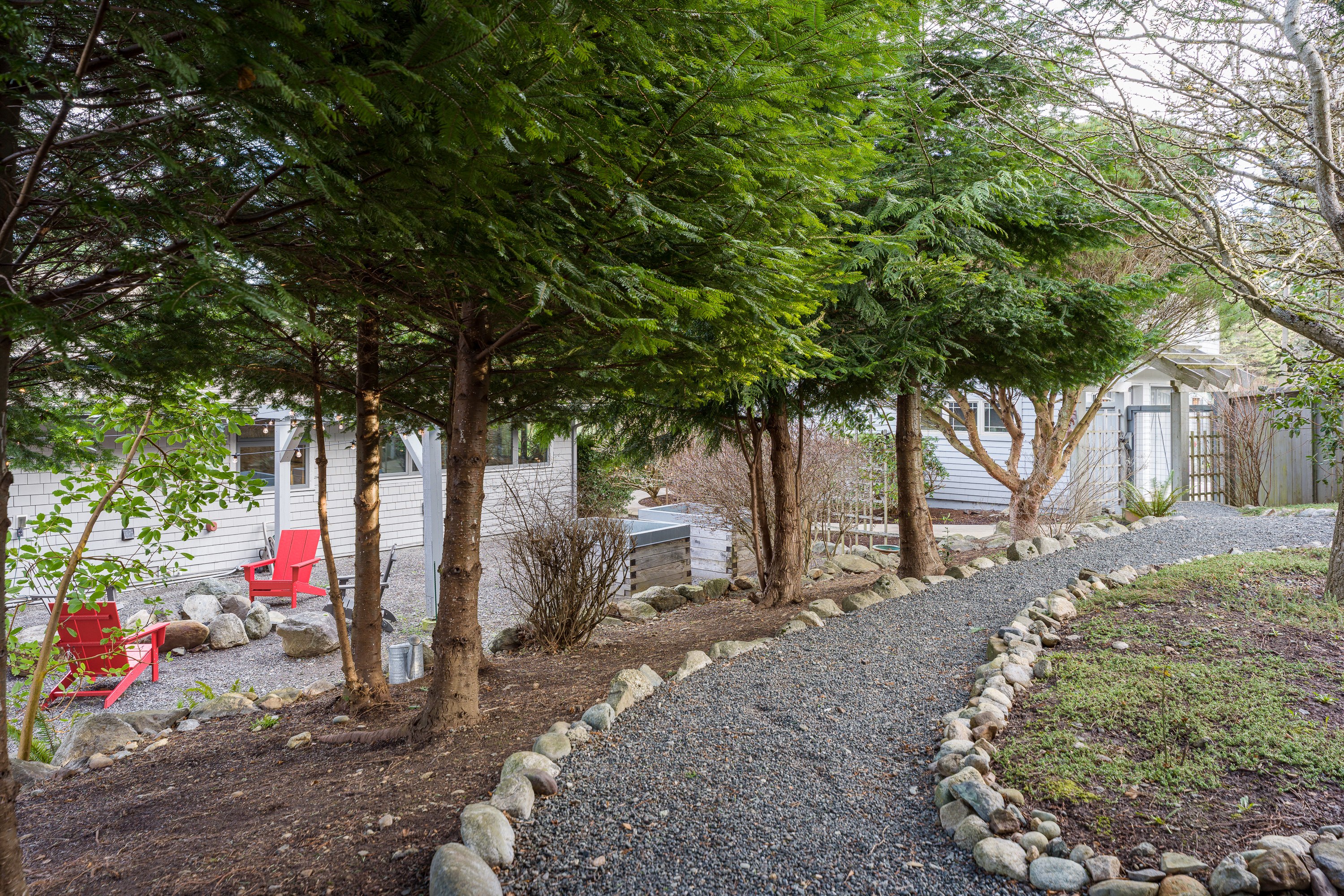 Stroll the gravel-lined path alongside your private outdoor retreat that includes fire pit and hot tub. This also makes for an amazing kid racetrack to get all those extra wiggles out!