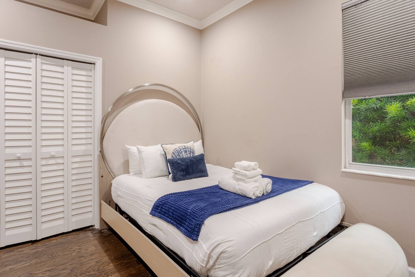 Comfortable guest room featuring a plush bed with quality linens, ample closet space, bedside tables, reading lamps, fresh towels, and thoughtful touches for a relaxing and restful stay.
