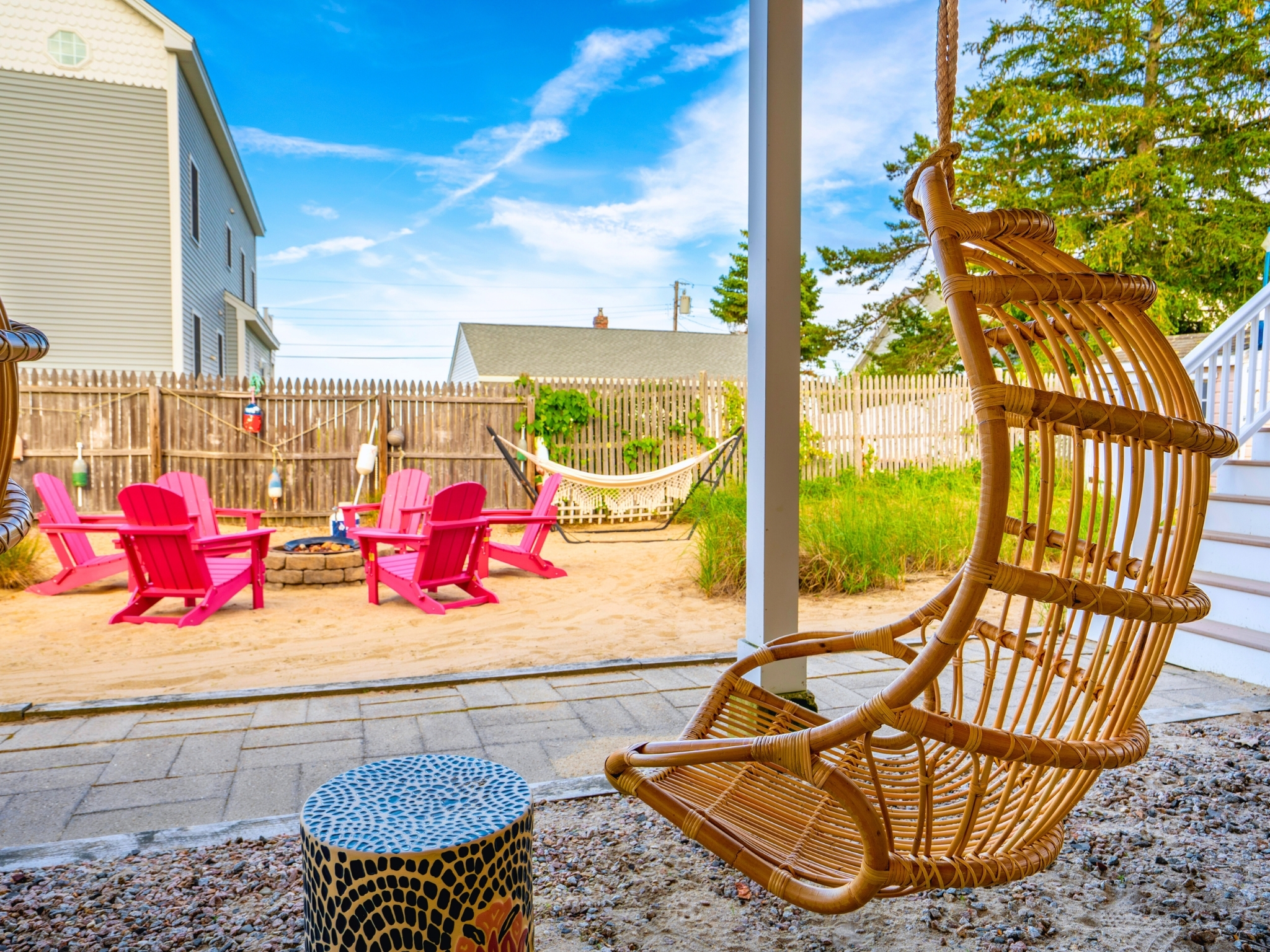 Take a seat on the swing and let the firepit’s glow set the perfect mood.