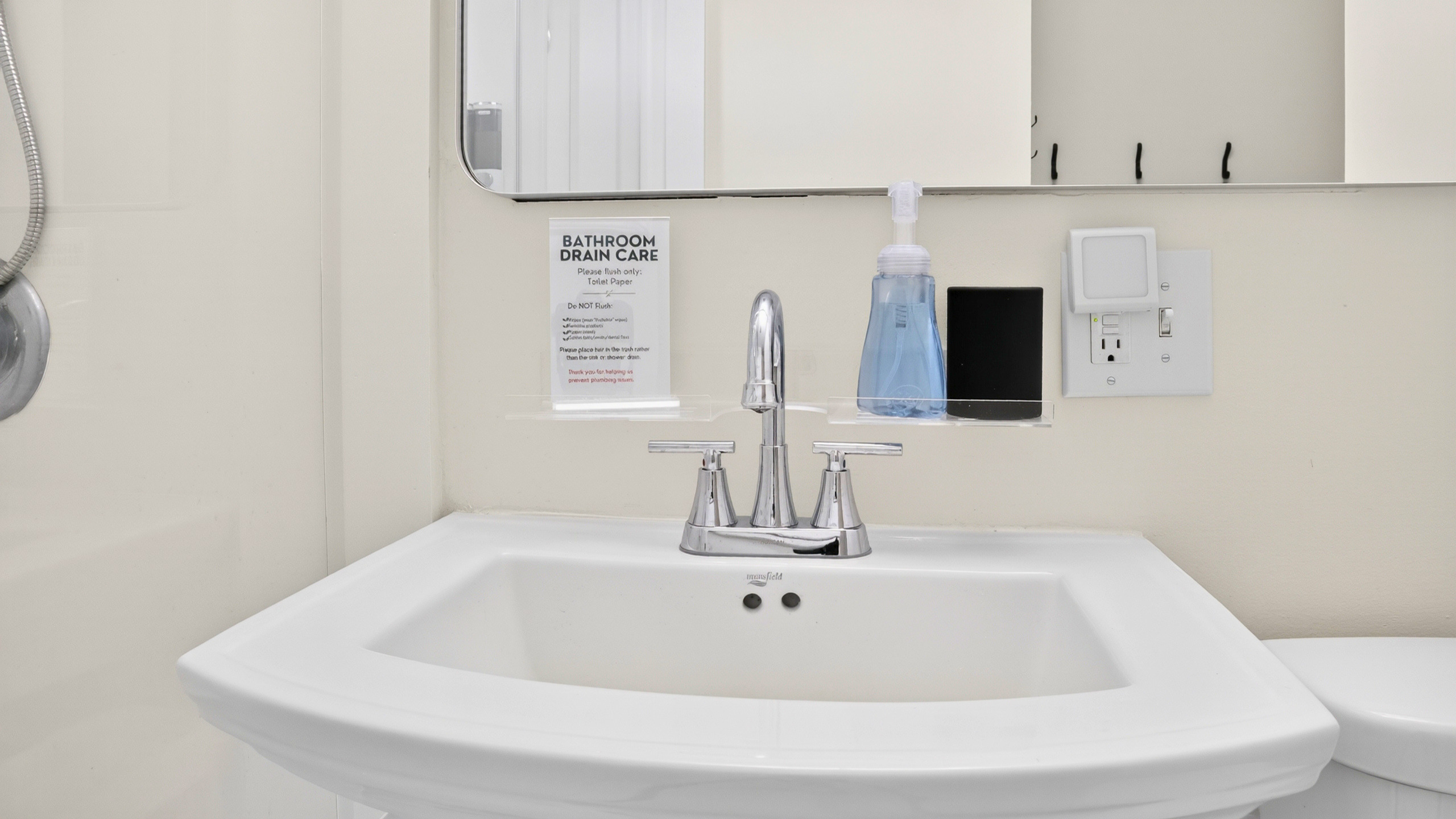 Bathroom vanity with thoughtful guest amenities.
