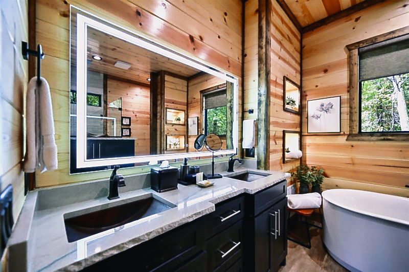 This spacious ensuite features a walk-in shower, soaking tub, and high-end finishes