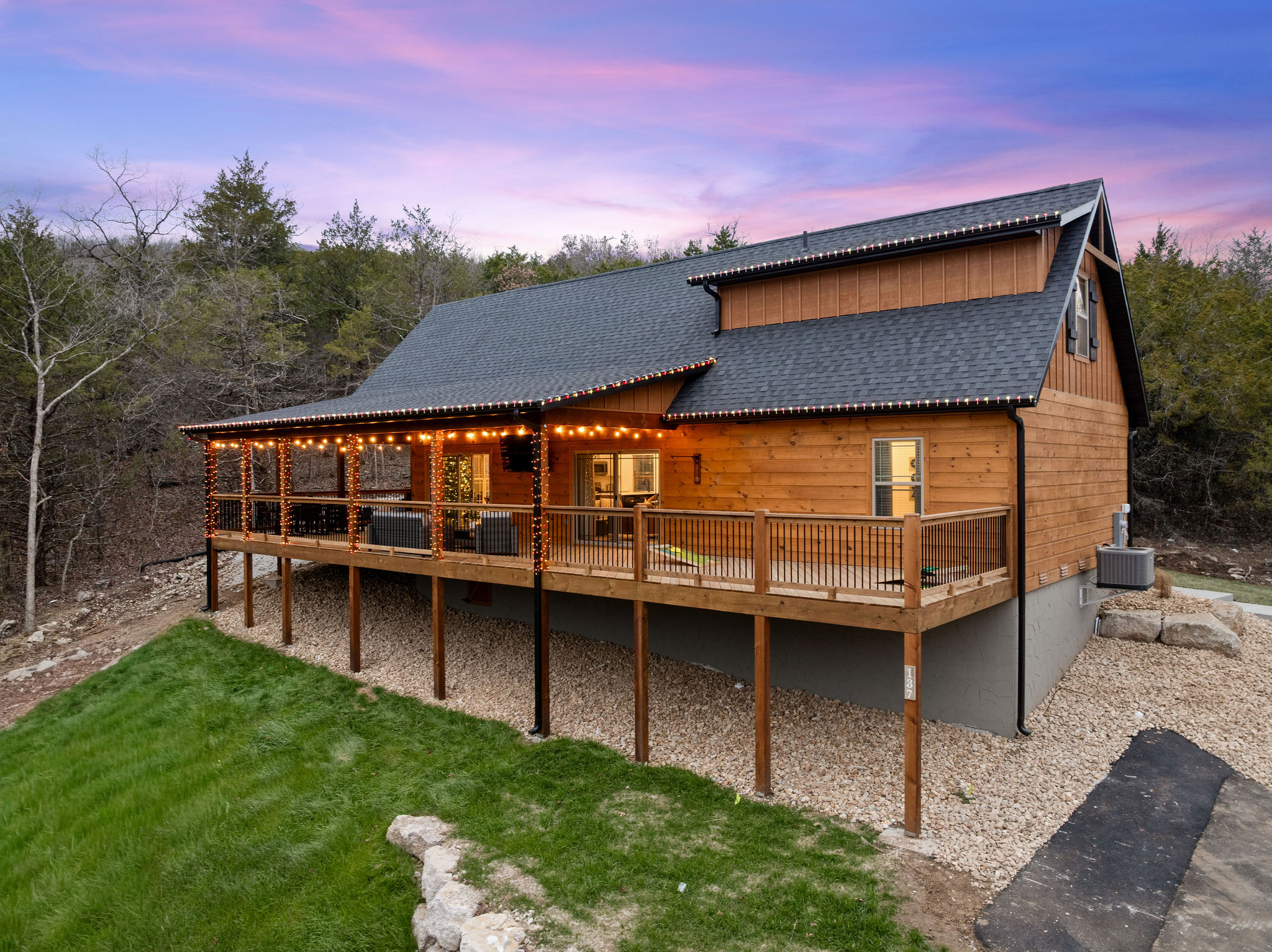 Soft lighting and natural surroundings create a relaxed outdoor feel.