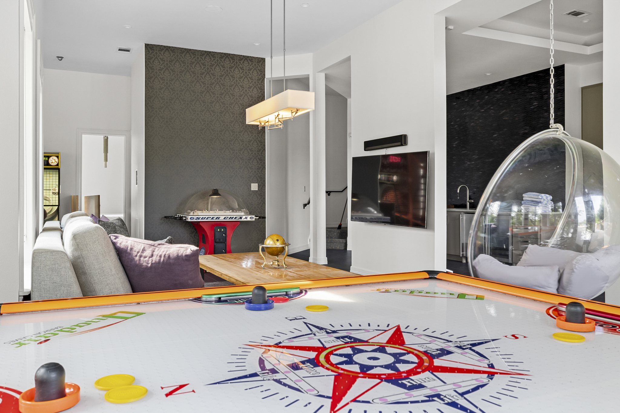 Commercial games include: Skee-Ball, QuadAir Hockey, Slam-N-Jam, CHEXX Bubble Hockey, and Boxer Machine