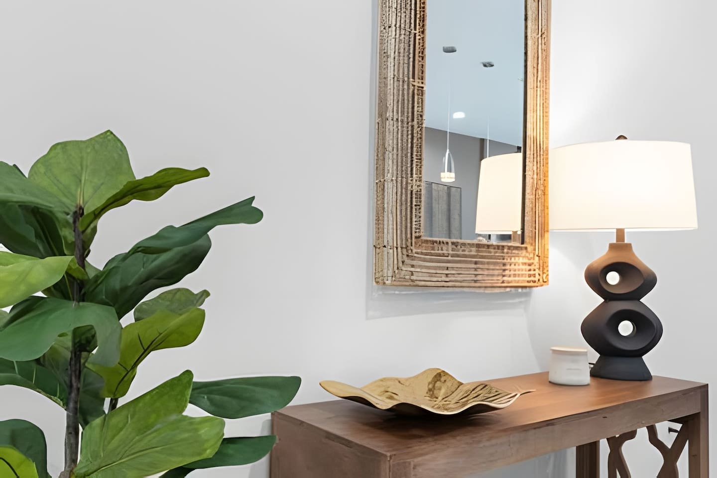 Subtle touches of decor and greenery add a fresh, welcoming vibe to the home.
